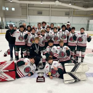 NT U14 AA team celebrating championship win with medals and trophy at Mary Parkinson Memorial AA Preseason Tournament