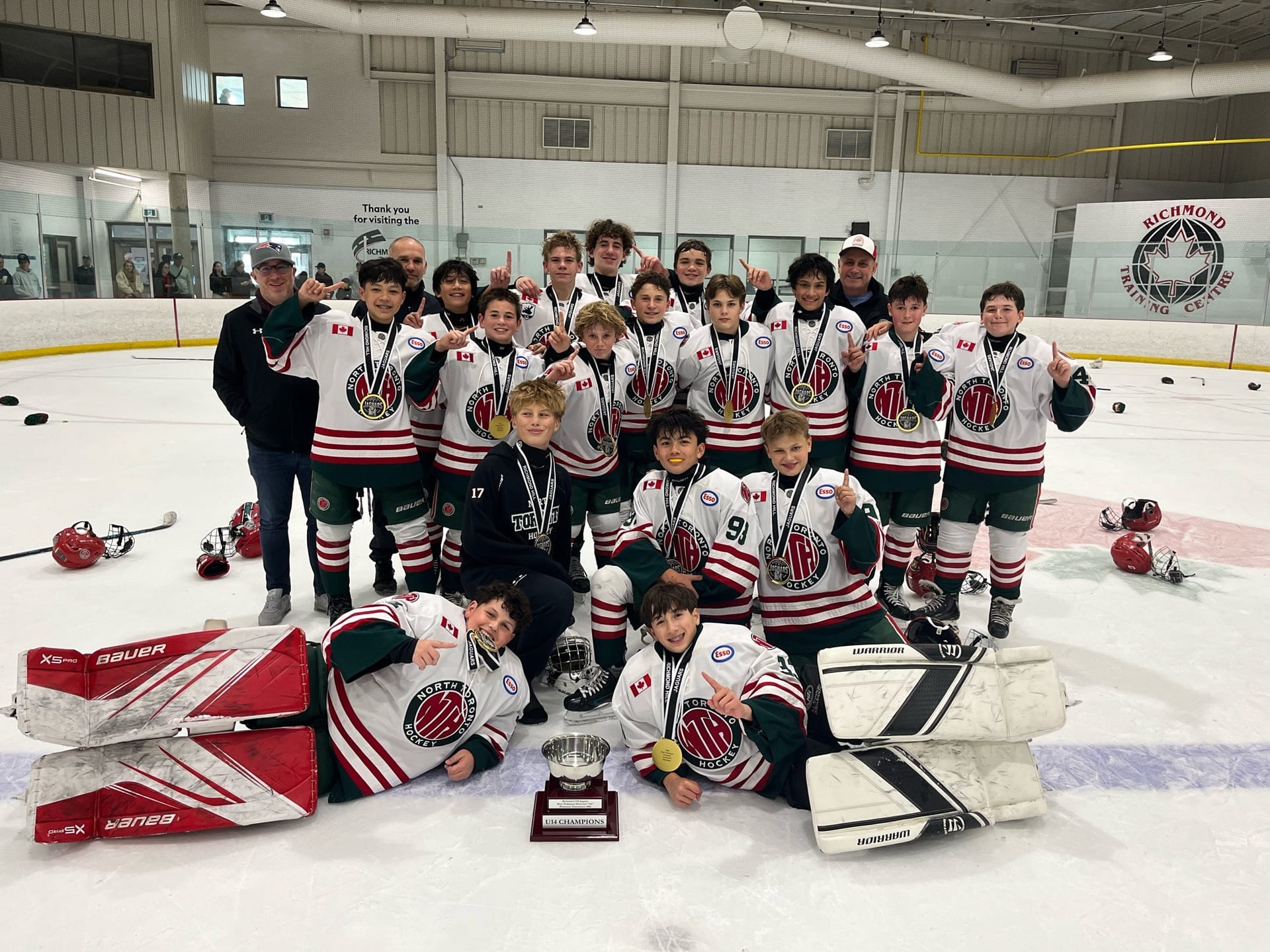 NT U14 AA team celebrating championship win with medals and trophy at Mary Parkinson Memorial AA Preseason Tournament