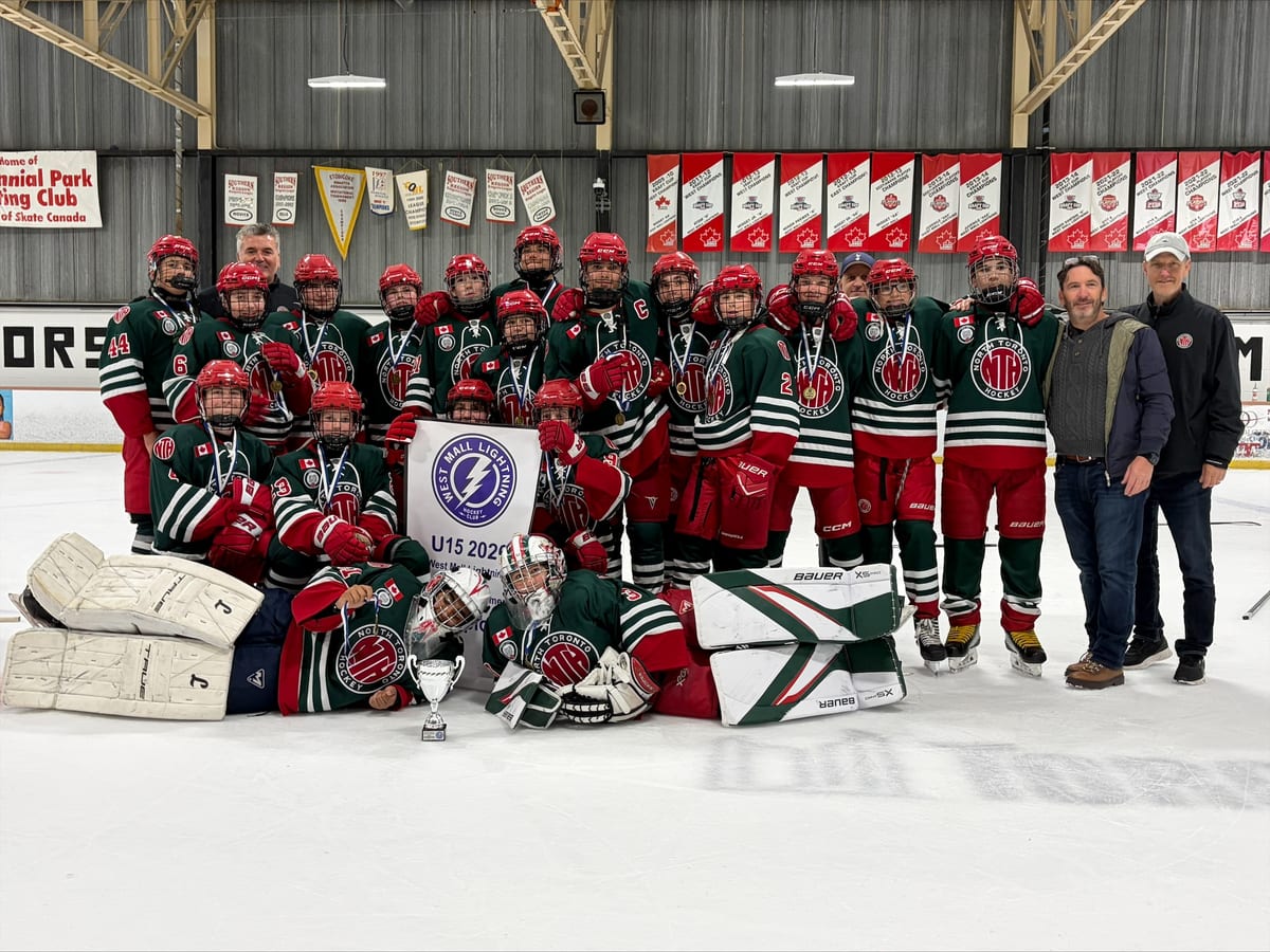 NT U15 Select team posing on the ice with medals and the championship trophy after winning the West Mall Lightning U15 A Tournament